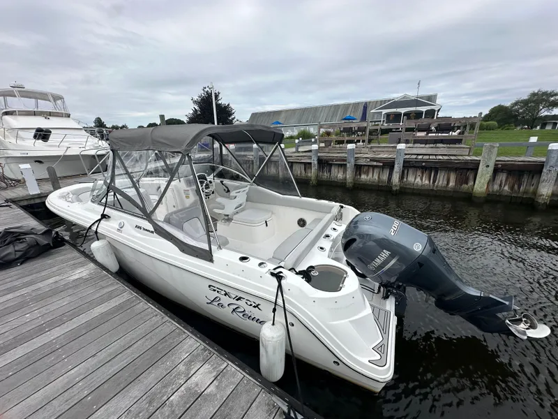 Slide: The Image of 2020 Sea Fox 226 Traveler boat docked with canopy and Yamaha outboard motor. - 3