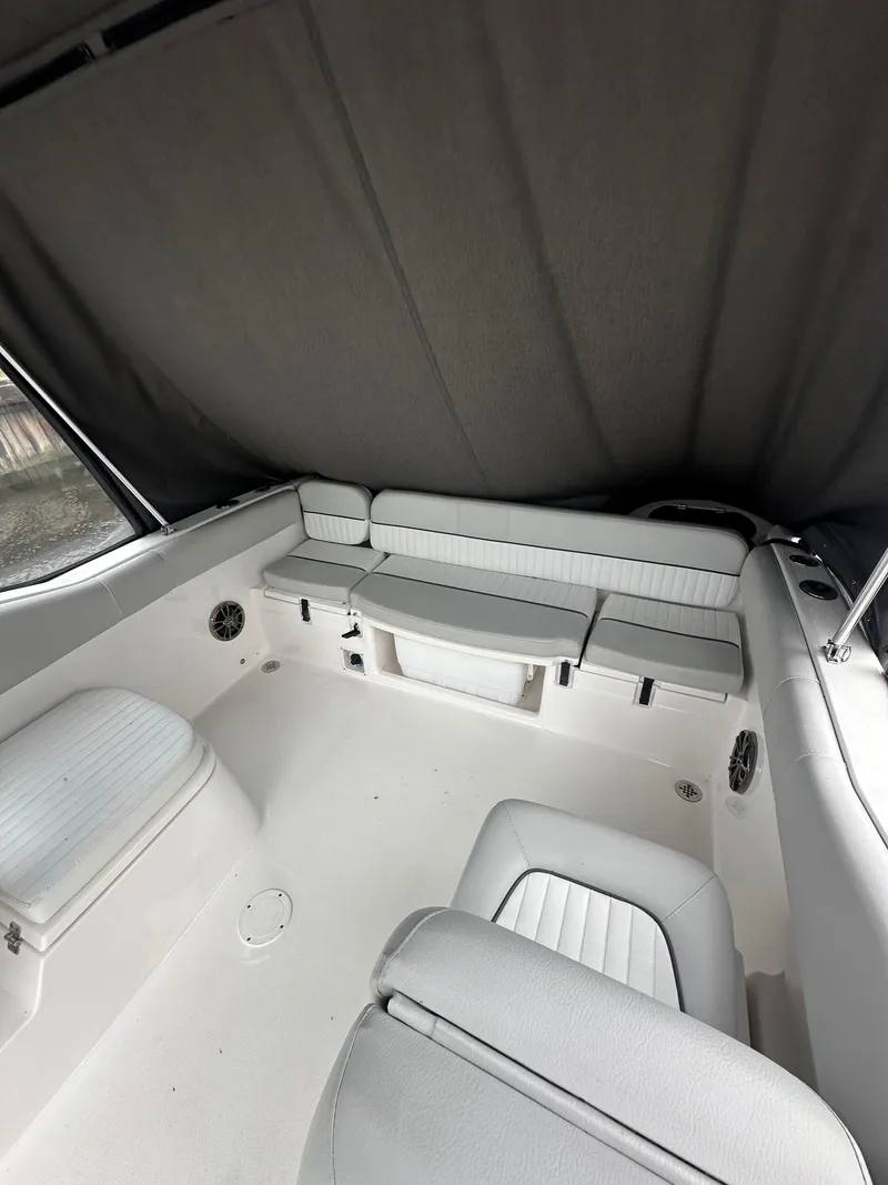 Slide: The Image of 2020 Sea Fox 226 Traveler boat interior with cushioned seating and storage. - 4