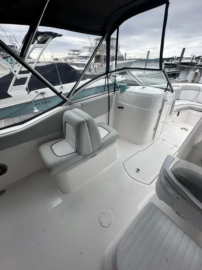 Slide: The Image of 2020 Sea Fox 226 Traveler boat interior with seating, docked at marina. - 5