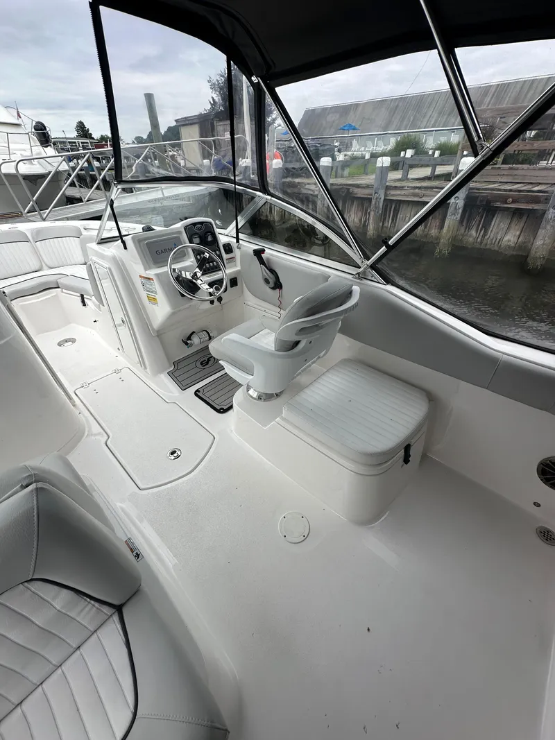 Slide: The Image of 2020 Sea Fox 226 Traveler boat interior with helm, seating, and canopy. - 6