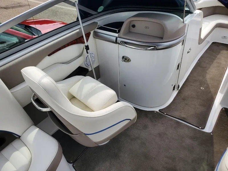 Slide: The Image of Interior of a 2007 Cobalt 240 boat with white seating and sleek design. - 11