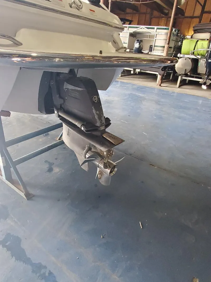 Slide: The Image of 2007 Cobalt 240 boat in storage, showing the stern and propeller. - 3