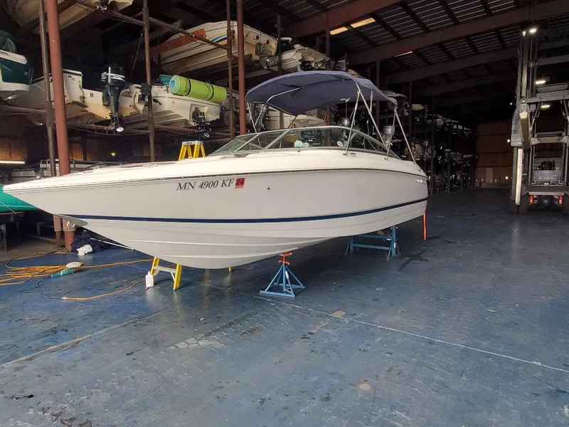 Slide: The Image of 2007 Cobalt 240 boat in indoor storage on stands. - 7