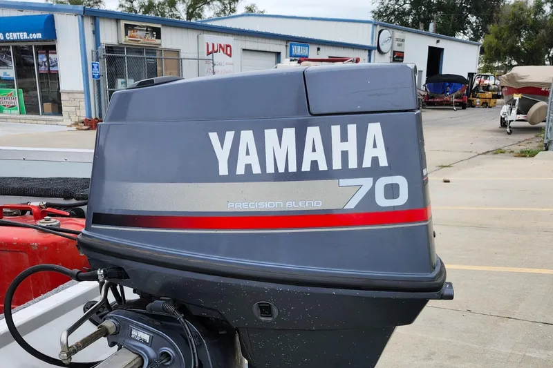 Slide: The Image of Yamaha 70 outboard motor on 1995 MirroCraft GUIDE IMPACT 16 V boat, outdoor setting. - 19