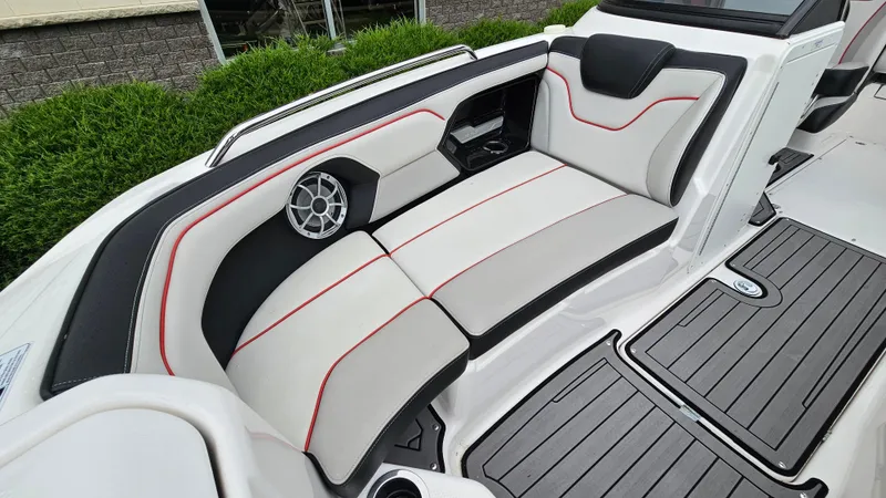 Slide: The Image of 2018 Yamaha Boats 212 X interior seating with sleek design and modern upholstery. - 16