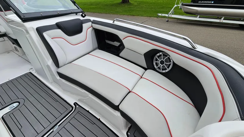 Slide: The Image of 2018 Yamaha Boats 212 X interior with stylish seating and speaker system. - 17