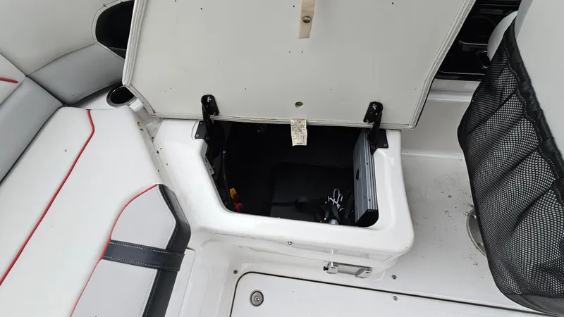 Slide: The Image of Open storage compartment in 2018 Yamaha Boats 212 X interior. - 23