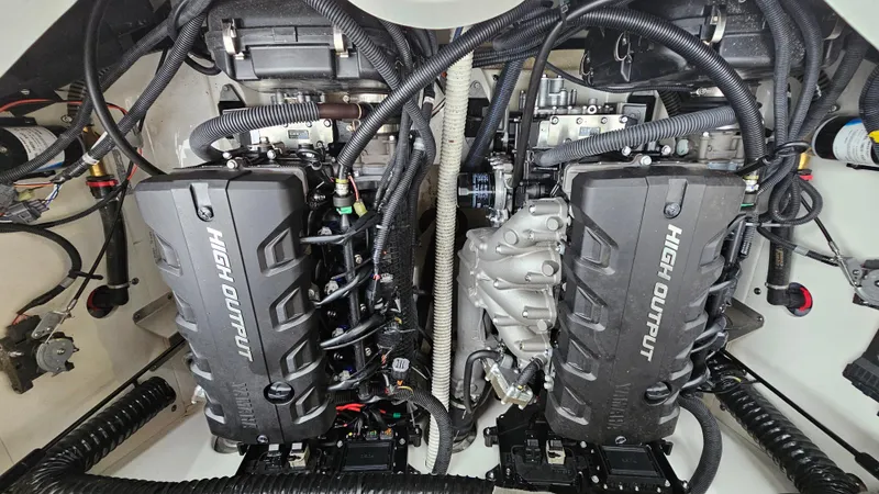 Slide: The Image of 2018 Yamaha Boats 212 X engine compartment with dual high output engines. - 24