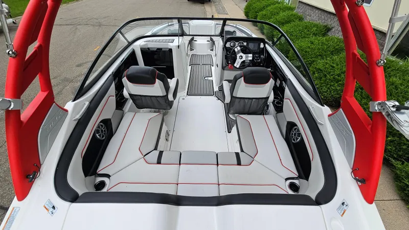 Slide: The Image of 2018 Yamaha Boats 212 X interior with red accents and modern seating. - 5
