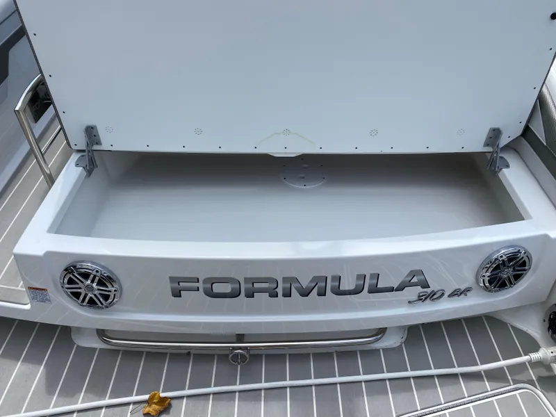 Slide: The Image of 2021 Formula 310 Bowrider I/O boat with open storage compartment. - 10