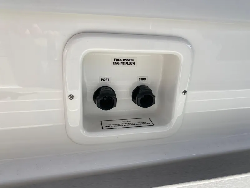 Slide: The Image of 2021 Formula 310 Bowrider I/O freshwater engine flush ports. - 13