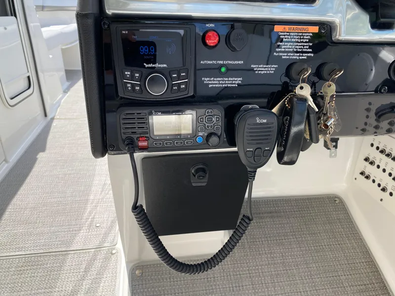 Slide: The Image of Control panel of 2021 Formula 310 Bowrider I/O with radio and keys. - 32