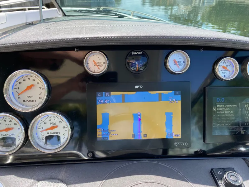 Slide: The Image of Dashboard of 2021 Formula 310 Bowrider I/O with gauges and digital display. - 34