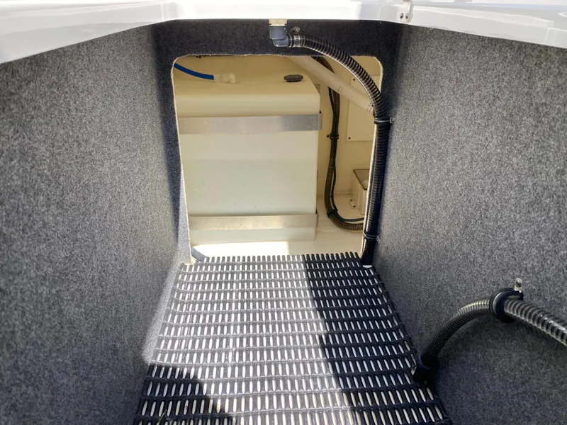 Slide: The Image of Interior view of 2021 Formula 310 Bowrider I/O boat, featuring carpeted flooring and wiring. - 37