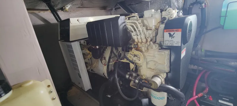 Slide: The Image of Engine room of 2003 Sea Ray 390 Motor Yacht, showcasing mechanical components. - 12