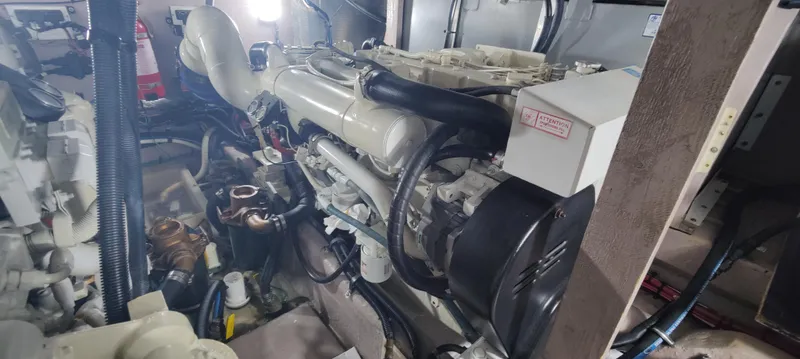 Slide: The Image of Engine room of 2003 Sea Ray 390 Motor Yacht, showcasing mechanical components and systems. - 13