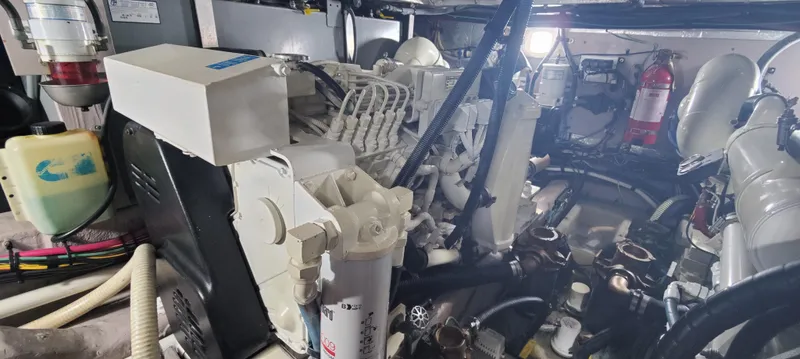 Slide: The Image of Engine room of 2003 Sea Ray 390 Motor Yacht, showcasing mechanical components and systems. - 14