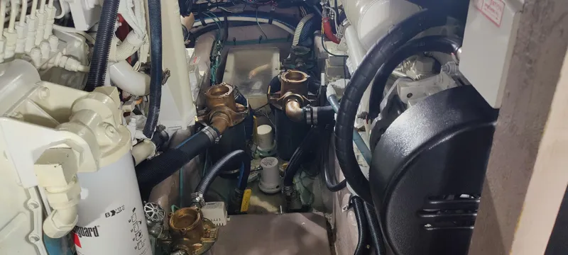 Slide: The Image of Engine room of 2003 Sea Ray 390 Motor Yacht with visible components and wiring. - 16