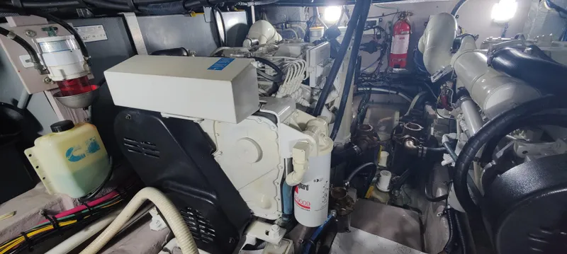 Slide: The Image of Engine room of 2003 Sea Ray 390 Motor Yacht, showcasing mechanical components and equipment. - 17