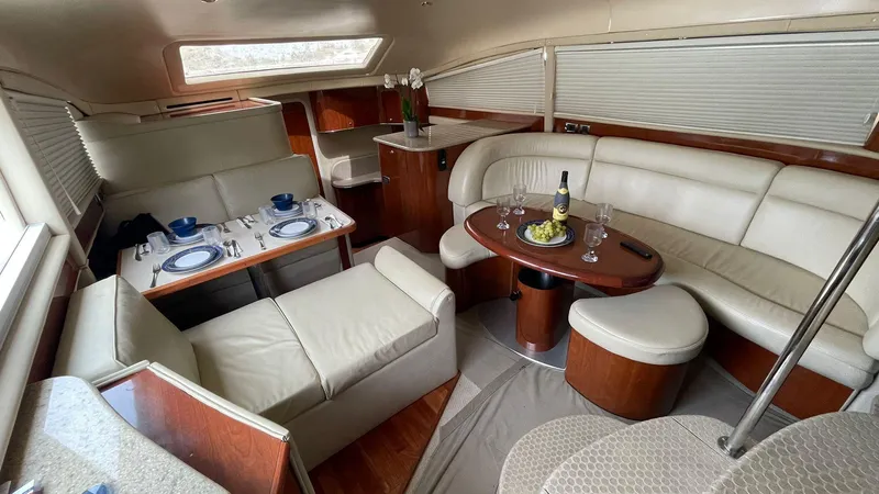 Slide: The Image of Luxurious interior of 2003 Sea Ray 390 Motor Yacht with elegant seating and dining area. - 8