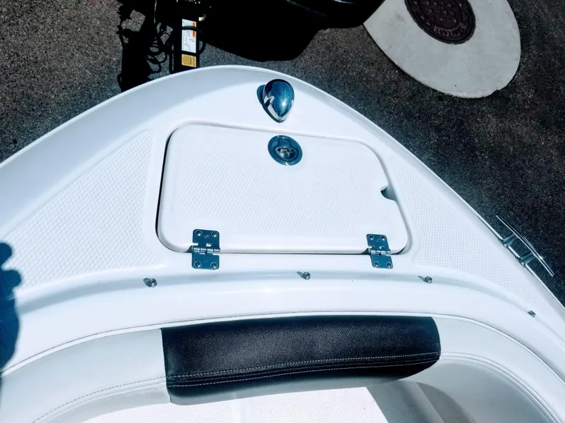 Slide: The Image of 2016 Chaparral 21 H2O Sport boat bow with storage compartment. - 12