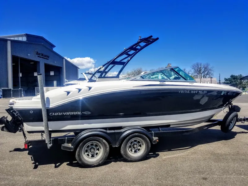 Slide: The Image of 2016 Chaparral 21 H2O Sport boat on trailer, parked outdoors. - 17