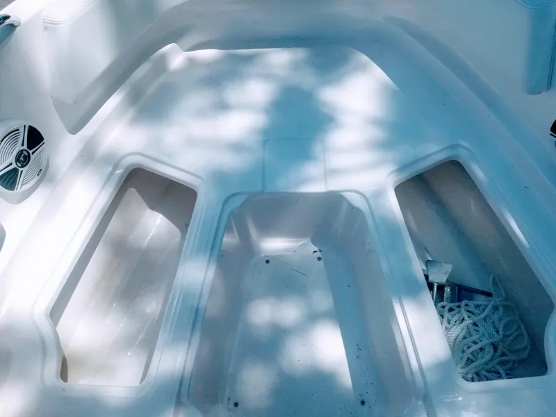 Slide: The Image of 2016 Chaparral 21 H2O Sport boat interior with storage compartments. - 22