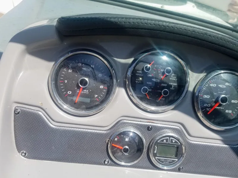 Slide: The Image of Dashboard of 2016 Chaparral 21 H2O Sport boat with gauges and controls. - 23