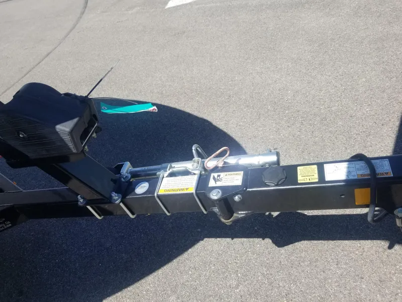 Slide: The Image of Trailer hitch of 2016 Chaparral 21 H2O Sport on asphalt surface. - 25