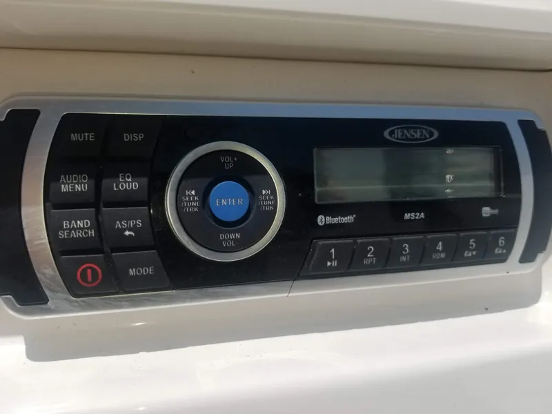 Slide: The Image of Jensen MS2A stereo system on 2016 Chaparral 21 H2O Sport boat dashboard. - 30