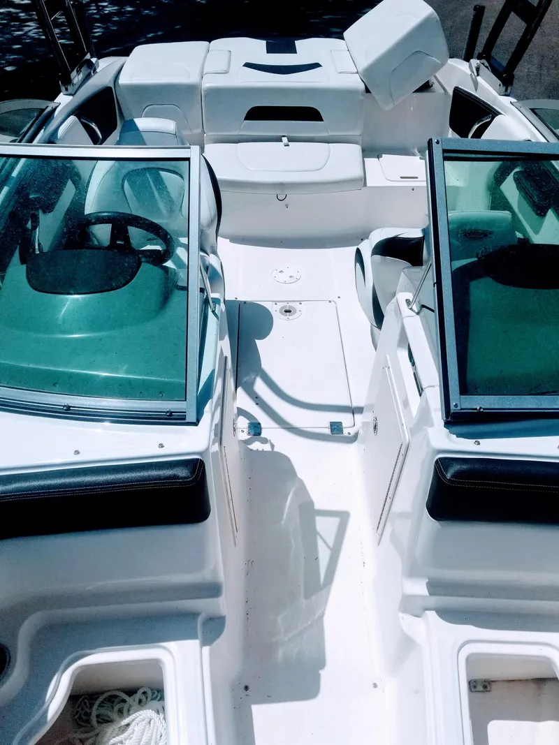 Slide: The Image of 2016 Chaparral 21 H2O Sport boat interior with seating and windshield. - 5