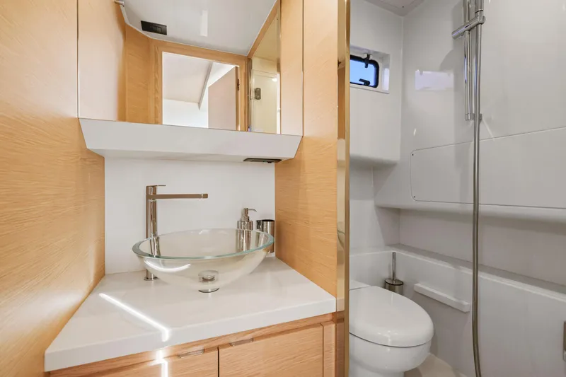 Slide: The Image of Luxurious bathroom in 2023 Solaris Power 40 Open yacht with modern fixtures and glass sink. - 29