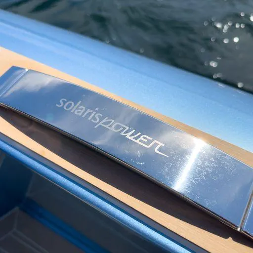 Slide: The Image of 2023 Solaris Power 40 Open boat detail with logo on metallic surface. - 38