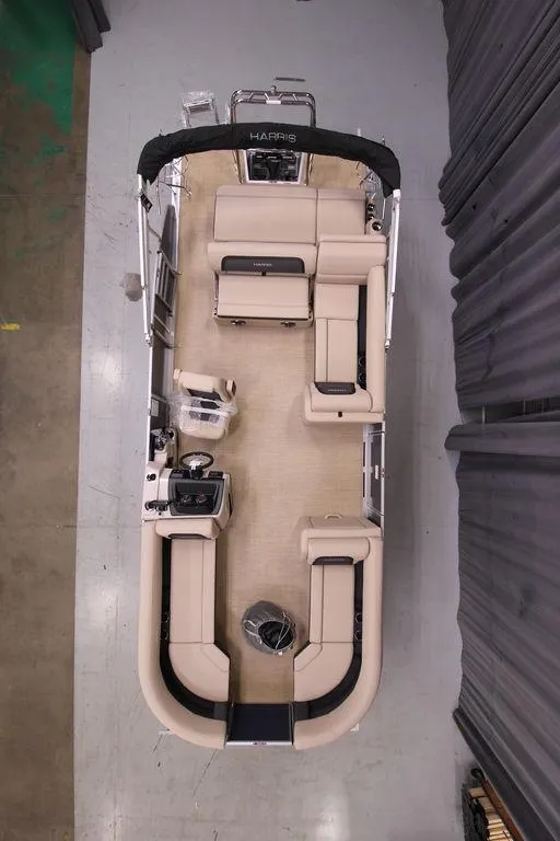 Slide: The Image of 2025 Harris CRUISER 230 SL pontoon boat, top view, beige seating, spacious layout. - 2