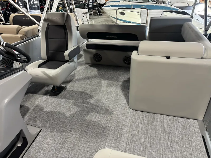 Slide: The Image of 2025 Harris Cruiser 210 SL interior with modern seating and sleek design. - 10