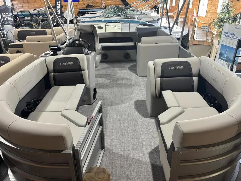 Slide: The Image of 2025 Harris Cruiser 210 SL pontoon boat interior with plush seating and modern design. - 14