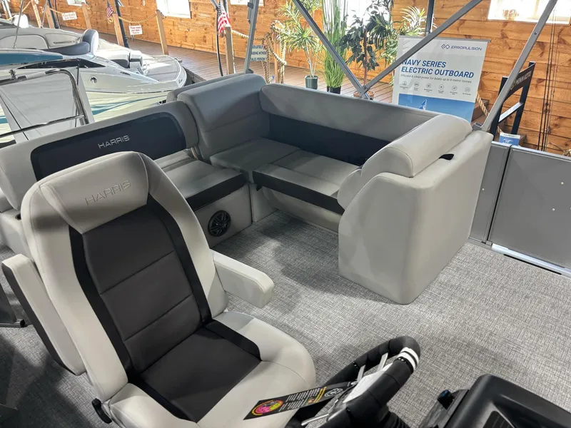 Slide: The Image of 2025 Harris Cruiser 210 SL interior with plush seating and modern design. - 7