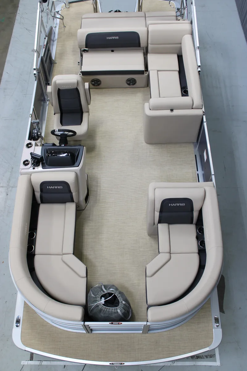 Slide: The Image of 2025 Harris Cruiser 210 SL pontoon boat interior with beige seating and modern design. - 6