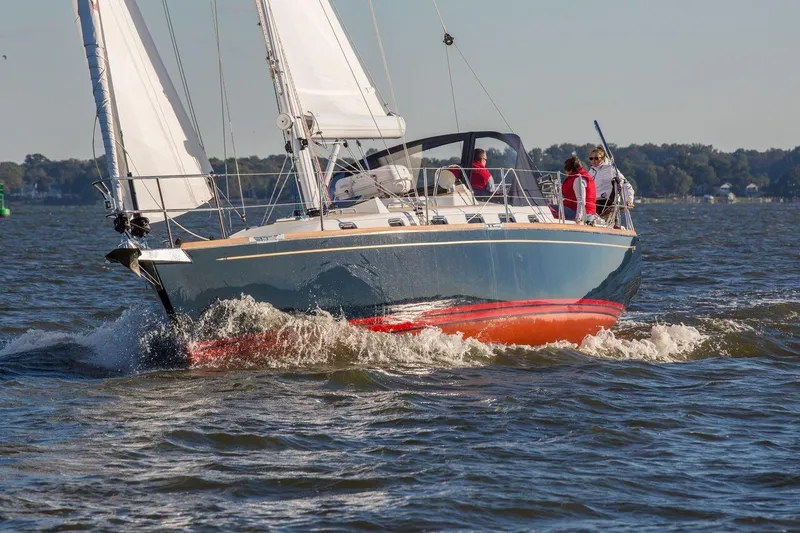 Slide: The Image of Sailing on a Tartan 395 yacht, 2025 model, cruising through open waters. - 10