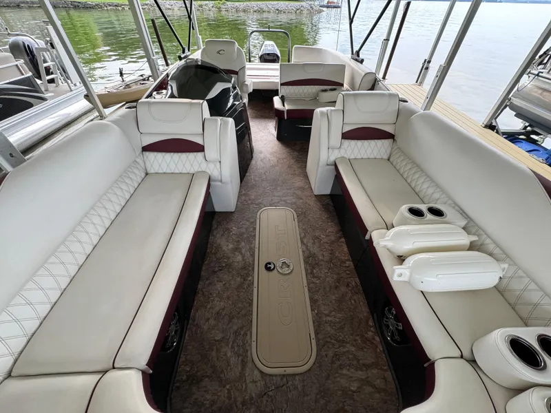 Slide: The Image of Luxurious 2019 Crest Caribbean 250 SLRC pontoon boat interior with spacious seating and elegant design. - 10