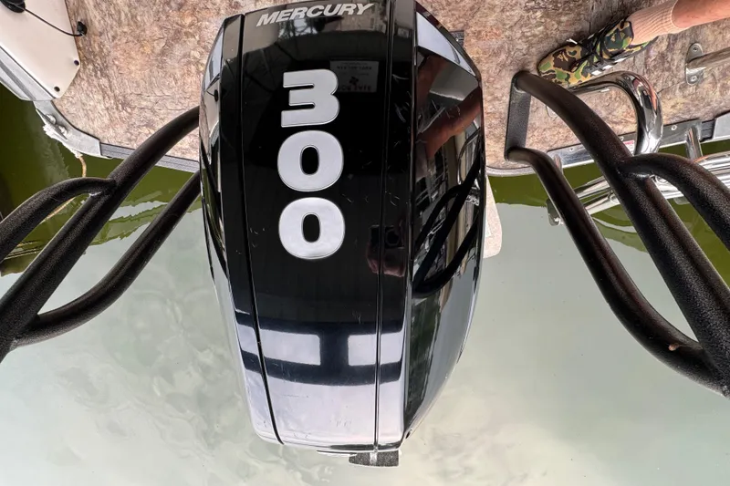 Slide: The Image of Outboard motor on 2019 Crest Caribbean 250 SLRC boat, featuring Mercury 300 horsepower engine. - 17