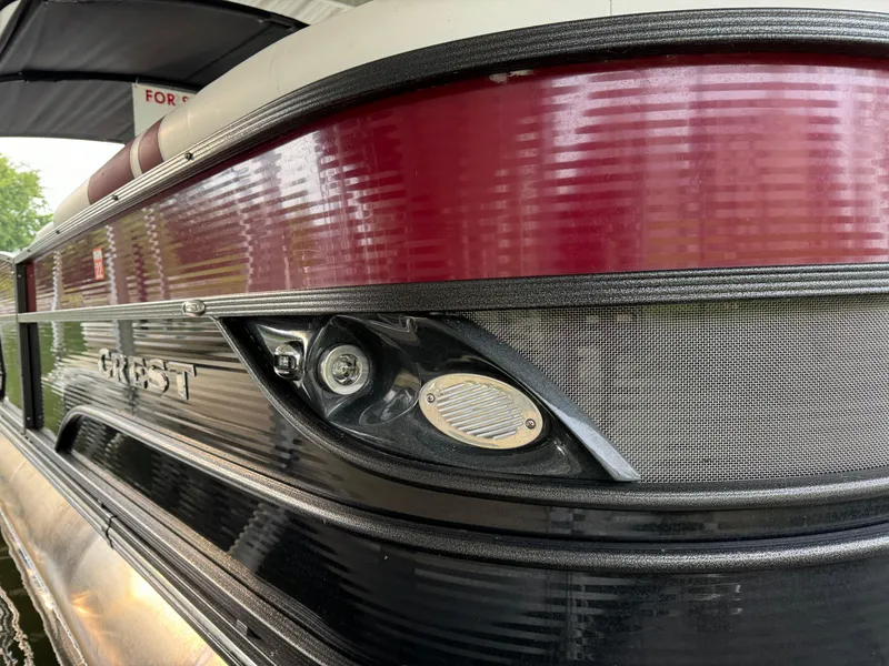 Slide: The Image of 2019 Crest Caribbean 250 SLRC boat with sleek red and black exterior design. - 3