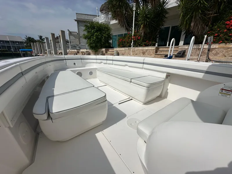 Slide: The Image of 2015 Intrepid 400 Center Console boat interior with white seating and spacious deck. - 10
