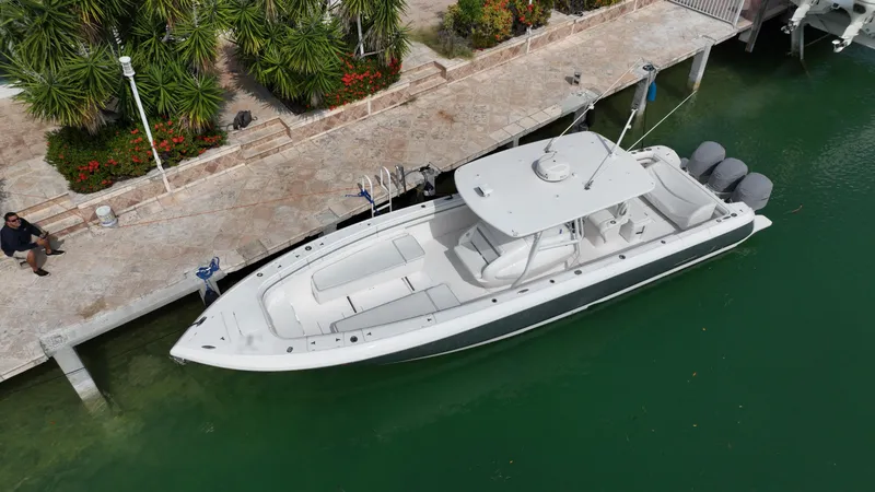 Slide: The Image of 2015 Intrepid 400 Center Console boat docked in a marina. - 14