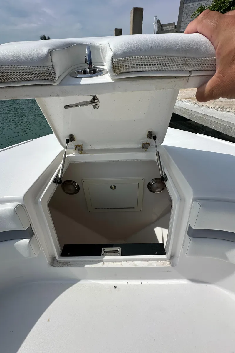 Slide: The Image of 2015 Intrepid 400 Center Console boat storage compartment open on deck. - 20