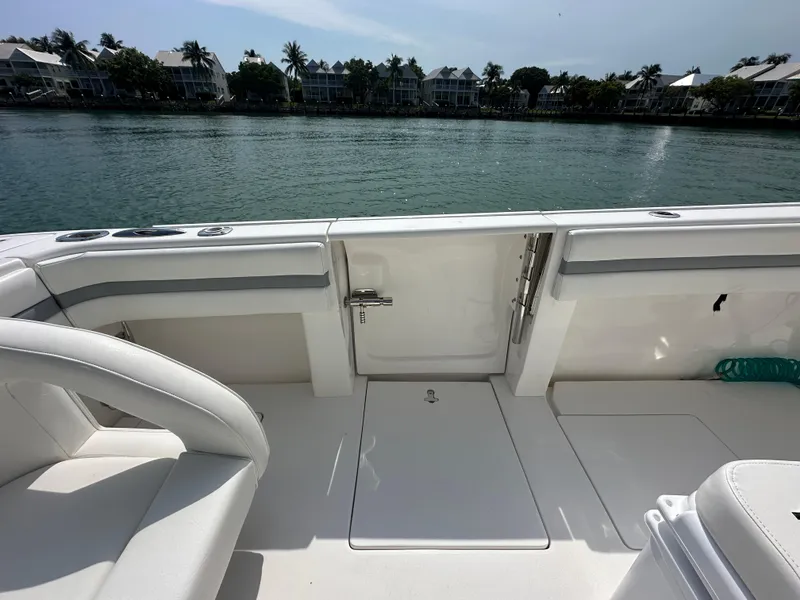 Slide: The Image of 2015 Intrepid 400 Center Console boat interior with waterfront view. - 6