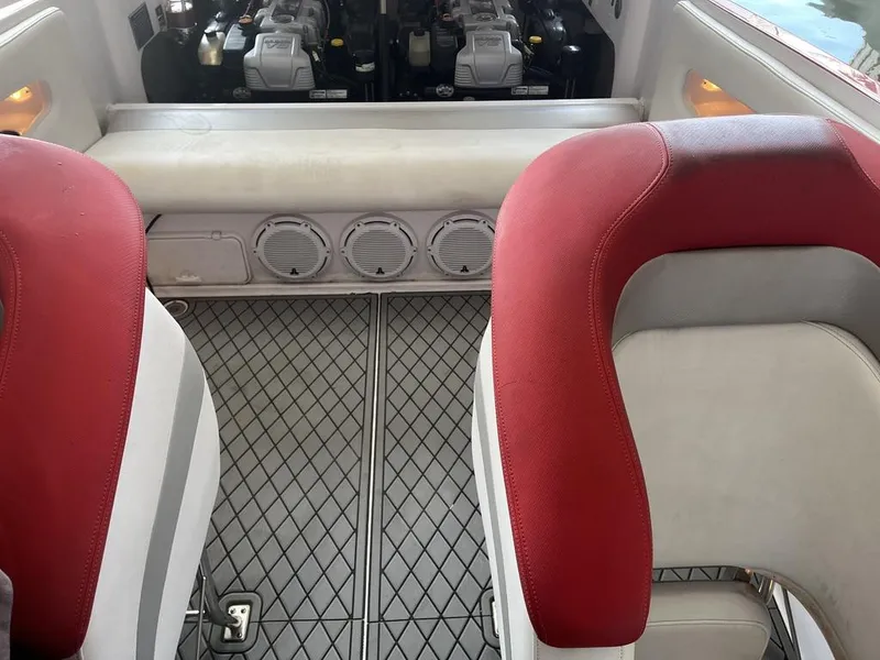 Slide: The Image of Interior of 2013 Baja 35 Outlaw boat with red and white seating. - 16