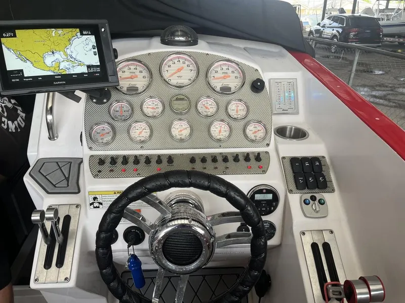 Slide: The Image of Dashboard of a 2013 Baja 35 Outlaw boat with navigation system and gauges. - 7