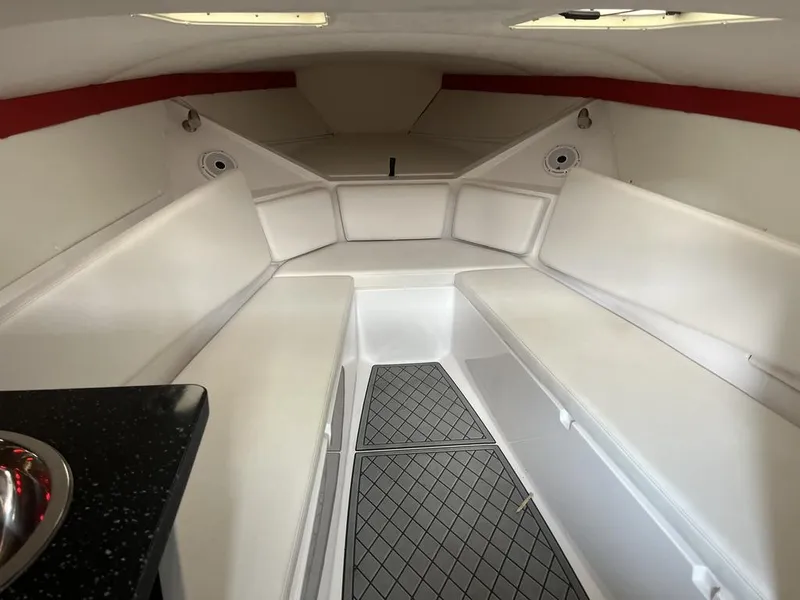 Slide: The Image of Interior of 2013 Baja 35 Outlaw boat with white seating and modern design. - 9