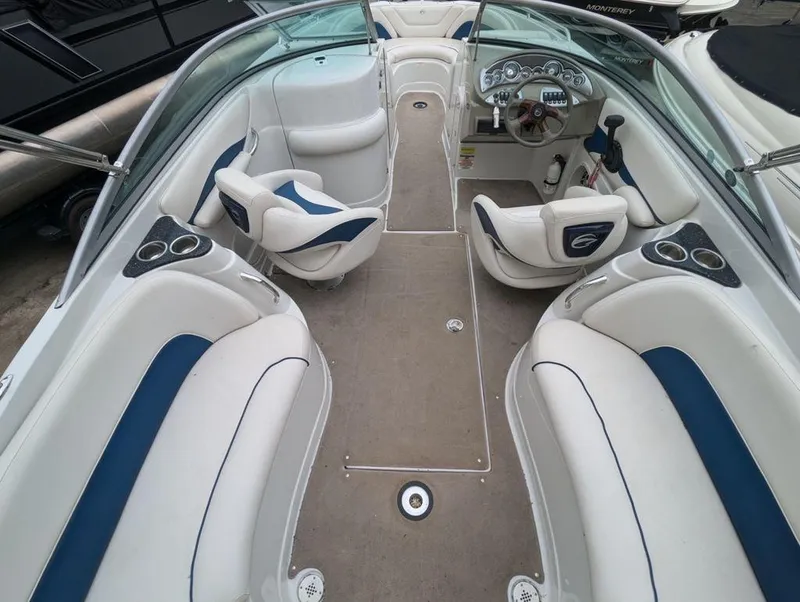 Slide: The Image of Interior of 2009 Crownline 240 LS boat with white and blue seating. - 6